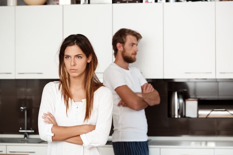 Displeased beautiful brunette girl in quarrel with her boyfriend background.