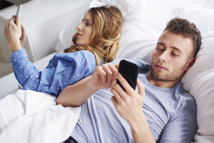 Young couple using wireless technology